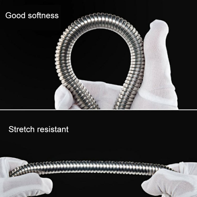 Flexible stainless steel shower hose loop held by white-gloved hands