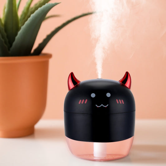 Black cute humidifier with red devil horns and glowing mist vent on top.