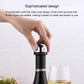 Mini champagne stopper in hand, chrome dome with black rotating lock base