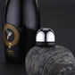Mini champagne bottle stopper on bottle neck, chrome dome with black collar