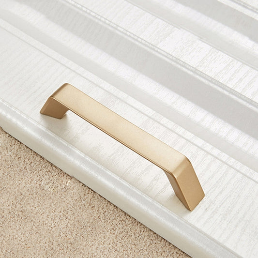 Gold zinc alloy cabinet drawer handle with rectangular finger pull, single piece.