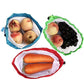 Three reusable mesh food pouches with drawstring ties, each filled with produce