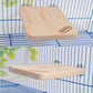 Light wood rectangular springboard with Carno logo, resting on a cage floor.