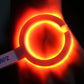 Illuminated circular scanning ring with orange-red glow