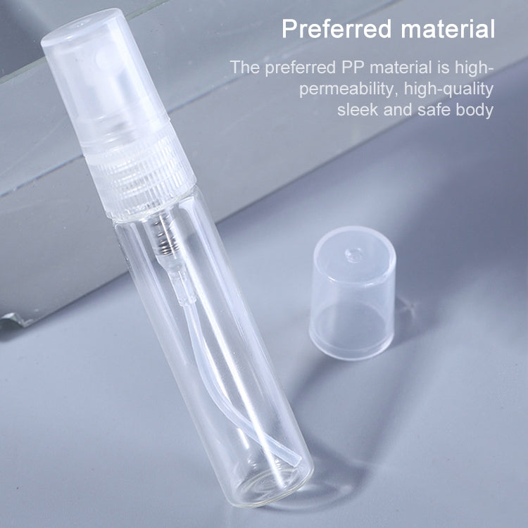 Transparent PP mini spray bottle with removable cap, angled close-up