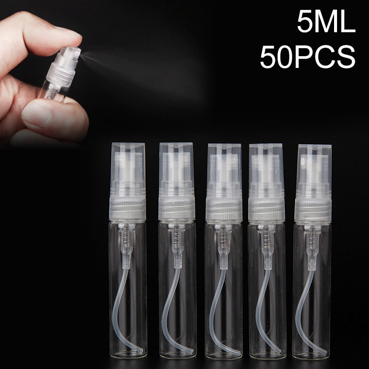Transparent 5ml perfume spray bottles, atomizer set of five with one bottle in hand
