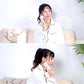 White facial massager used on face by a person during a skincare session