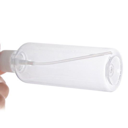 Clear PET spray bottle with white spray nozzle end