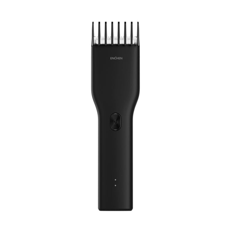Black electric hair trimmer with metal blade and power button