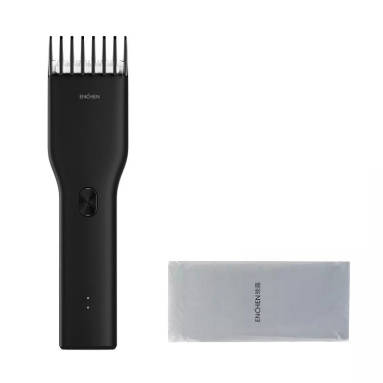 Black electric hair trimmer with detachable blade and included cleaning cloth