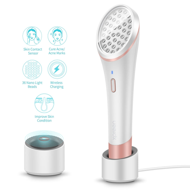 Wireless acne light device with circular LED head shown next to charging base