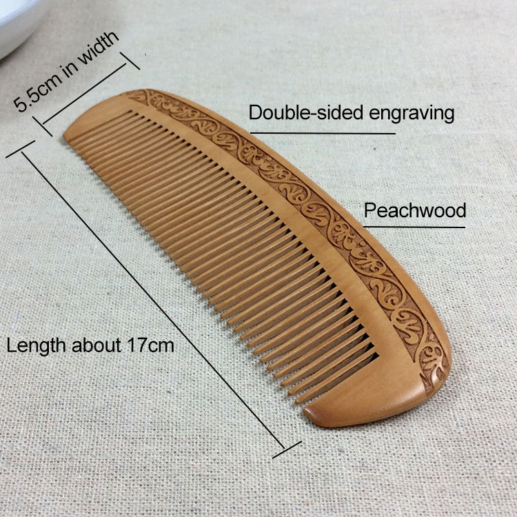 Brown wooden comb with carved floral design and fine, evenly spaced teeth