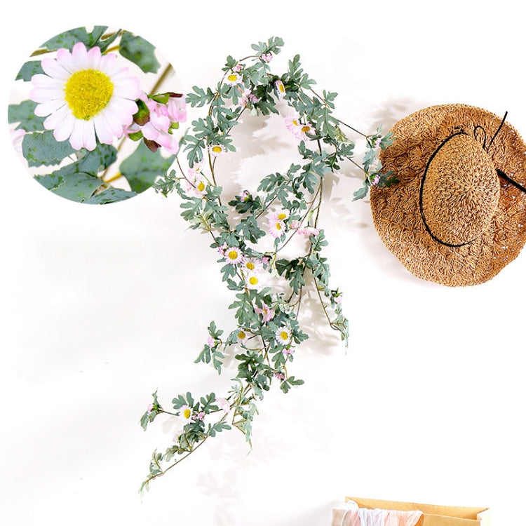 Artificial flower vine with pale pink daisy blossoms and green leaves, hanging style