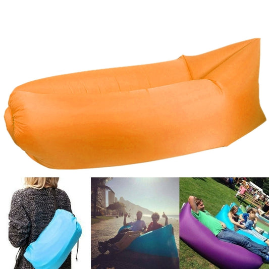 Orange inflatable lounger sofa with cushioned air chamber and raised headrest