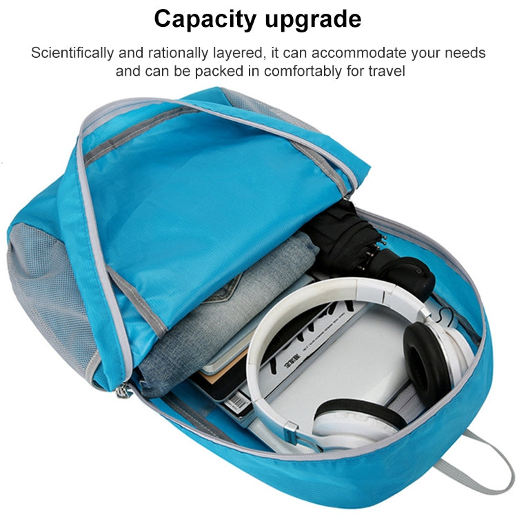 Open blue foldable backpack showing layered storage space and interior zip organizer