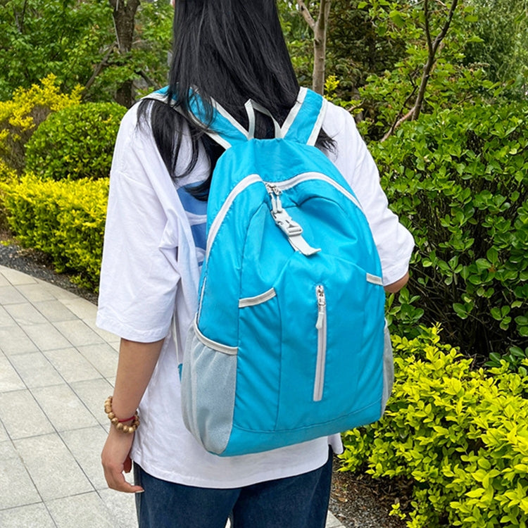Large capacity hiking backpack in light blue with front zip pocket and padded straps