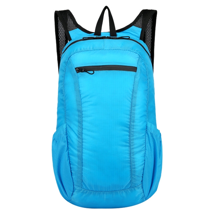 Light blue folding waterproof backpack with black mesh side panels and top handle.