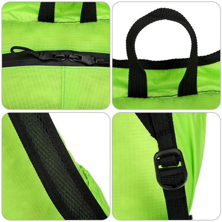 Bright green foldable backpack close-up of reinforced handle and black adjustable straps.