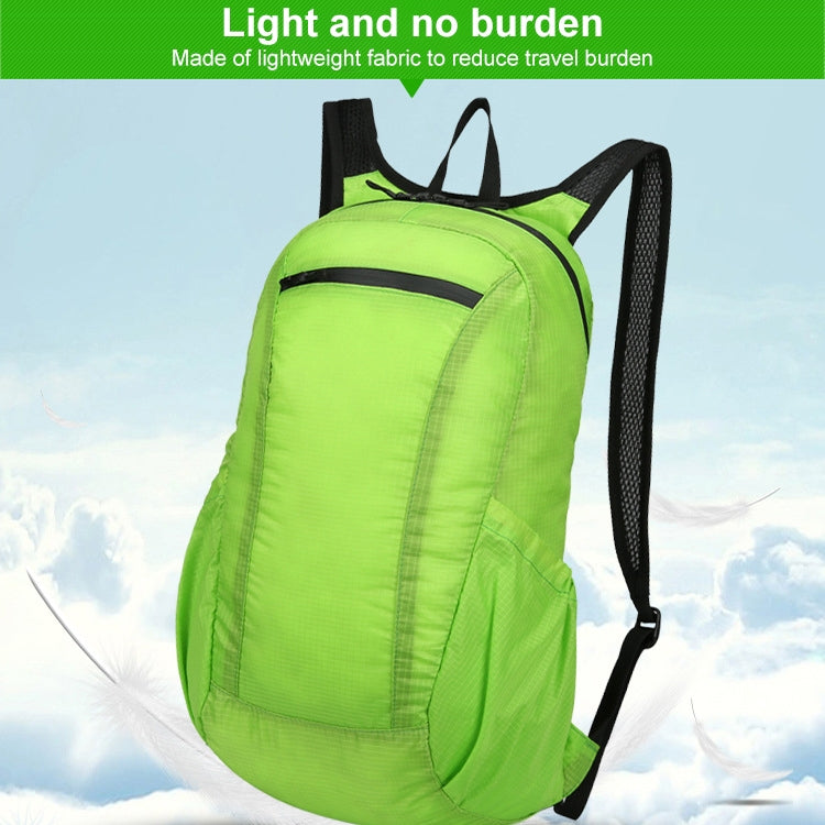 Bright green lightweight foldable backpack with black mesh side panels and top handle.