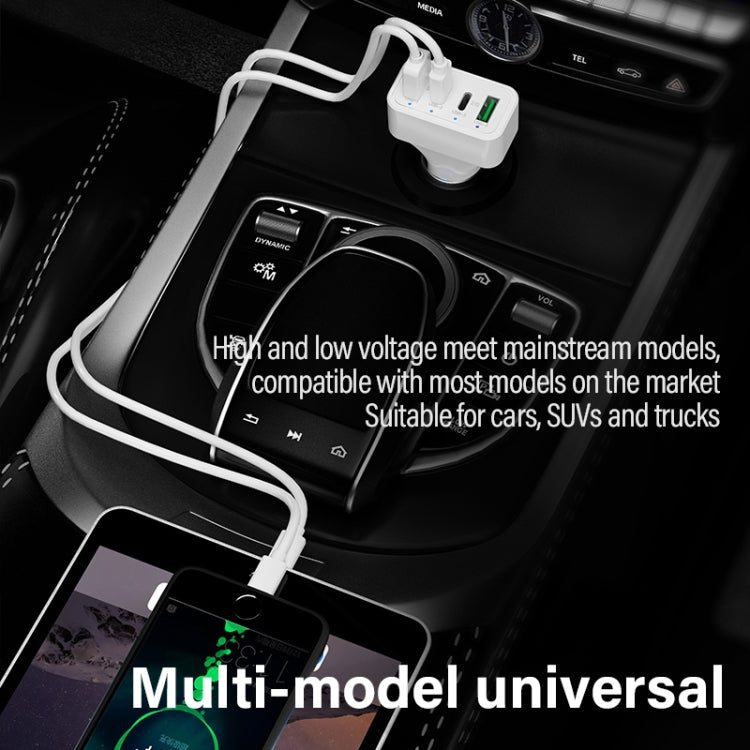 White dual-port car charger with multiple cables connected in console