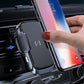Car wireless charging phone holder with hand adjusting the phone on the mount