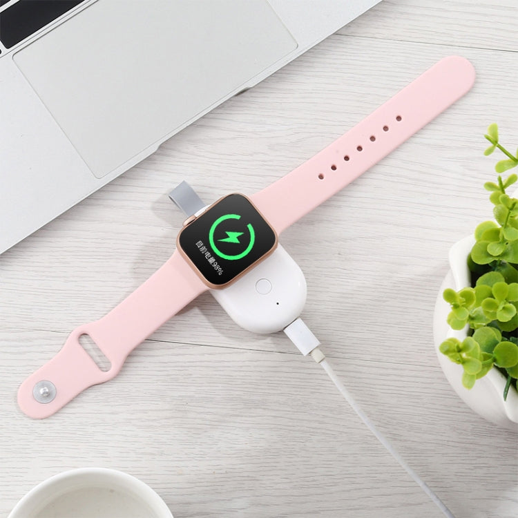 Magnetic wireless charger for Apple Watch on pink band with charging indicator light