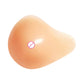 Silicone breast pad with spiral shape, smooth light peach curved surface.