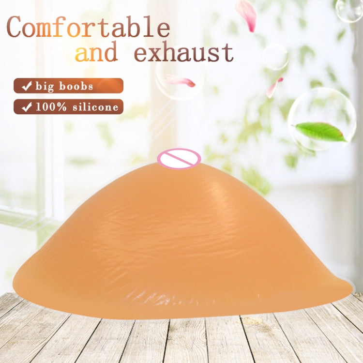 Silicone breast pad, light peach curved spiral shape for postoperative rehabilitation.