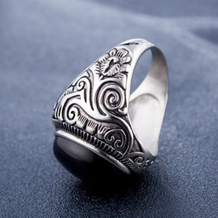 Men’s titanium steel ring with dark oval gemstone and decorative side engravings