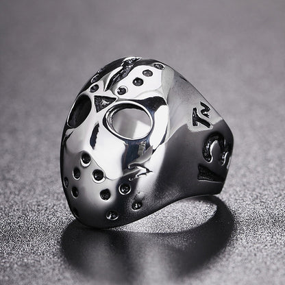 Skull mask style titanium steel ring in silver with black inlays, open face detail