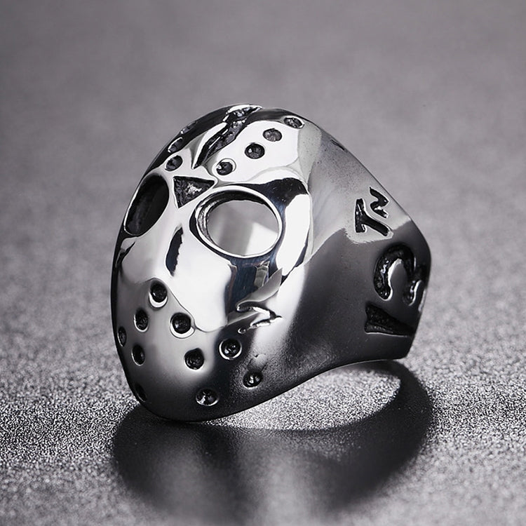 Skull mask ring with circular eye openings and dotted embellishments, silver with black accents