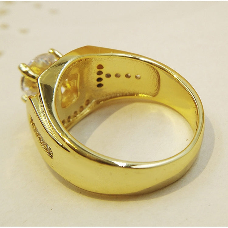 Gold-tone men’s ring with band interior and prong setting visible