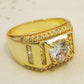 Gold-plated men’s diamond ring side view with center round stone and small channel accents
