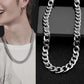 Silver curb-link chain necklace close-up with bold interlocking links