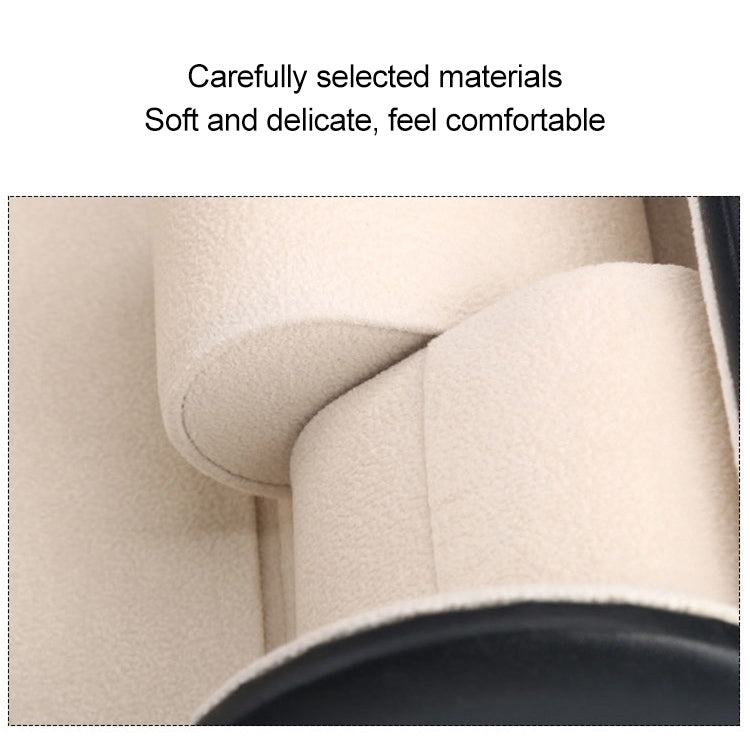 Beige soft lining inside a watch storage cylinder, showing cushion-like texture