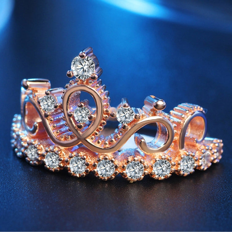 Rose gold crown-shaped zircon ring with central oval stone and round stones across band