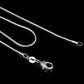 Silver snake-bone chain necklace close-up with lobster clasp and rings