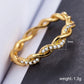 Gold twist style rhinestone ring with full stone bezel links, US size 8