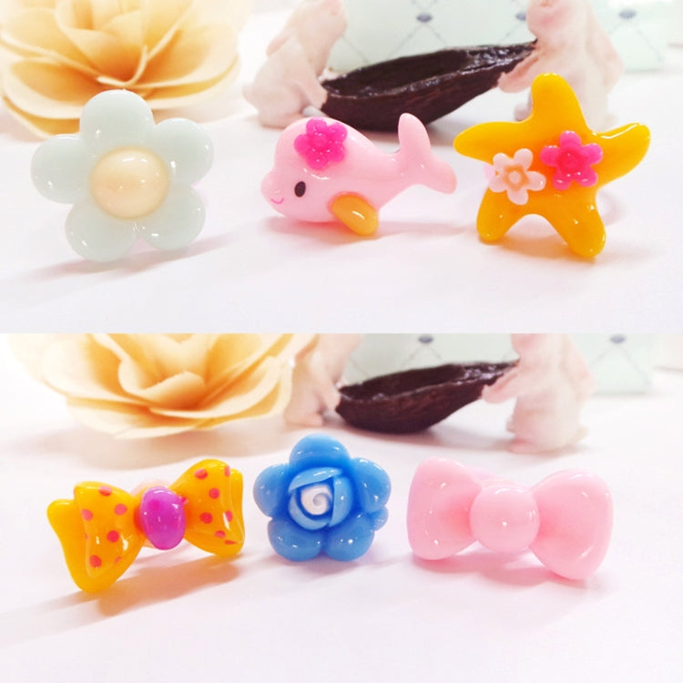 Assorted kids resin character rings featuring flower, bunny, and star shapes in bright colors