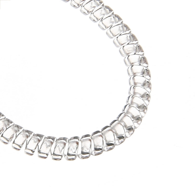 Close-up of silver spiral beads on a ring size adjuster