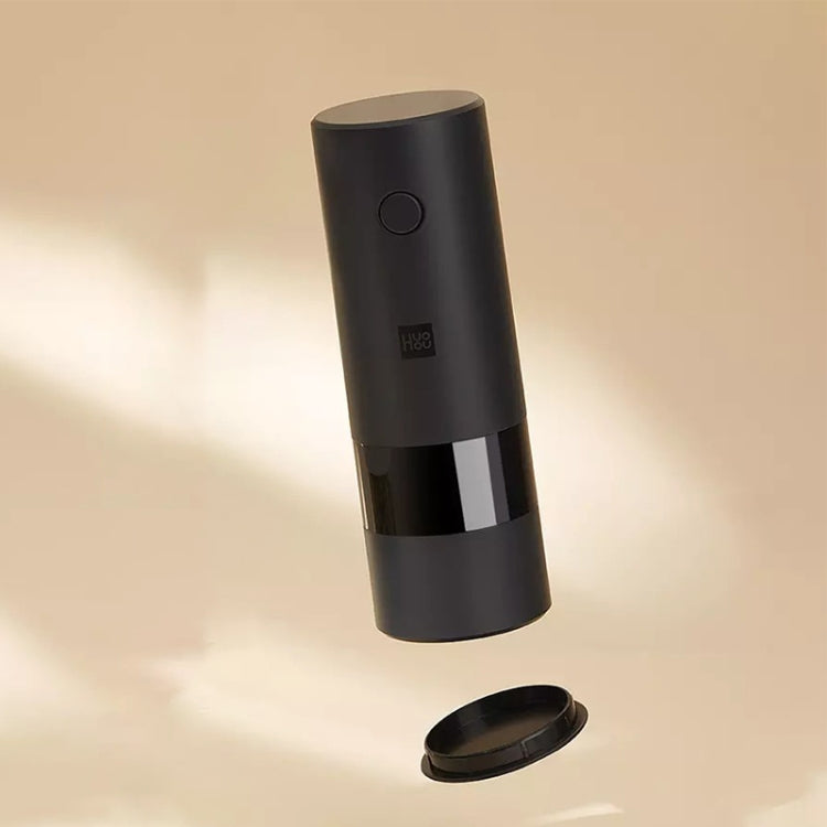 Electric pepper grinder, black cylinder with button and clear base chamber