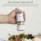 Electric pepper grinder, black with open bottom chamber and removable dust cover