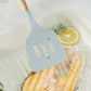 Silicone slotted cooking spatula with light wood handle