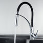 Pull-out kitchen faucet with black-and-chrome spout spraying water from the hose