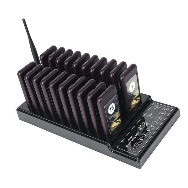 Wireless paging base with dark purple pagers, call screens, and keypad on black dock
