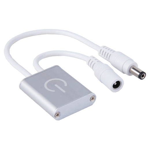 Touch LED dimmer controller, silver-gray box with two white cable connectors