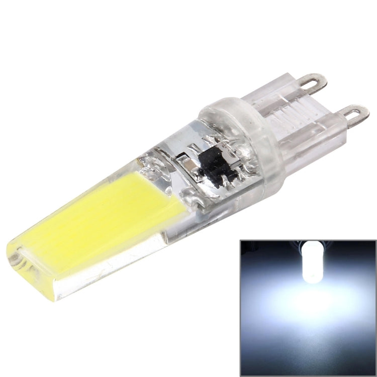 Transparent LED dimmable plug bulb with yellow COB strip and two metal pins