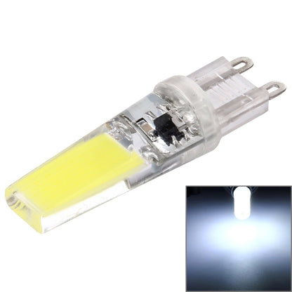 Transparent LED dimmable plug bulb with yellow COB strip and two metal pins