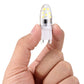 Dimmable LED G9 bulb held in hands, clear capsule with 14 SMD LEDs