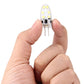 Small clear 12-SMD LED capsule module with two pins held in hand